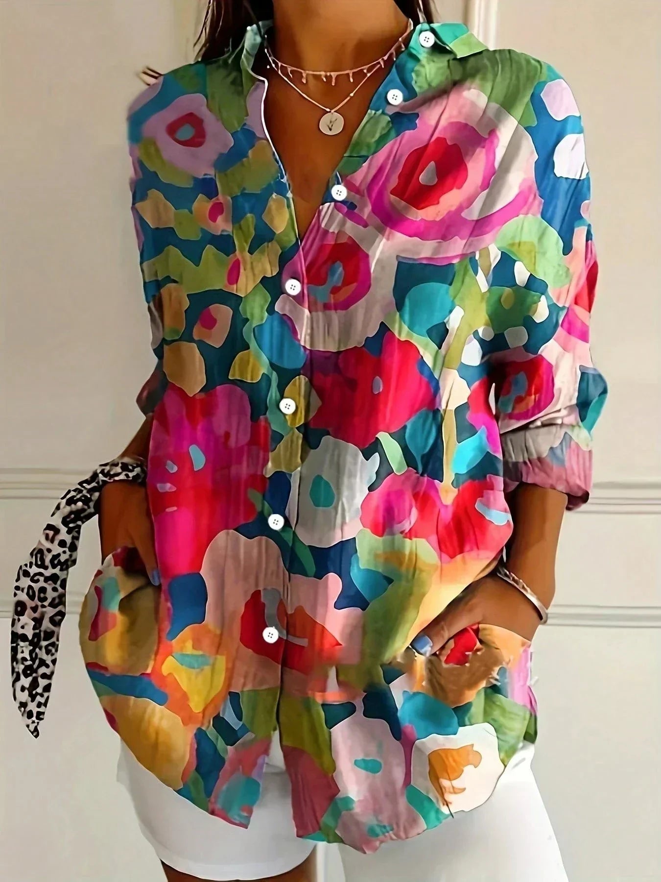 Colourful blouse with playful print